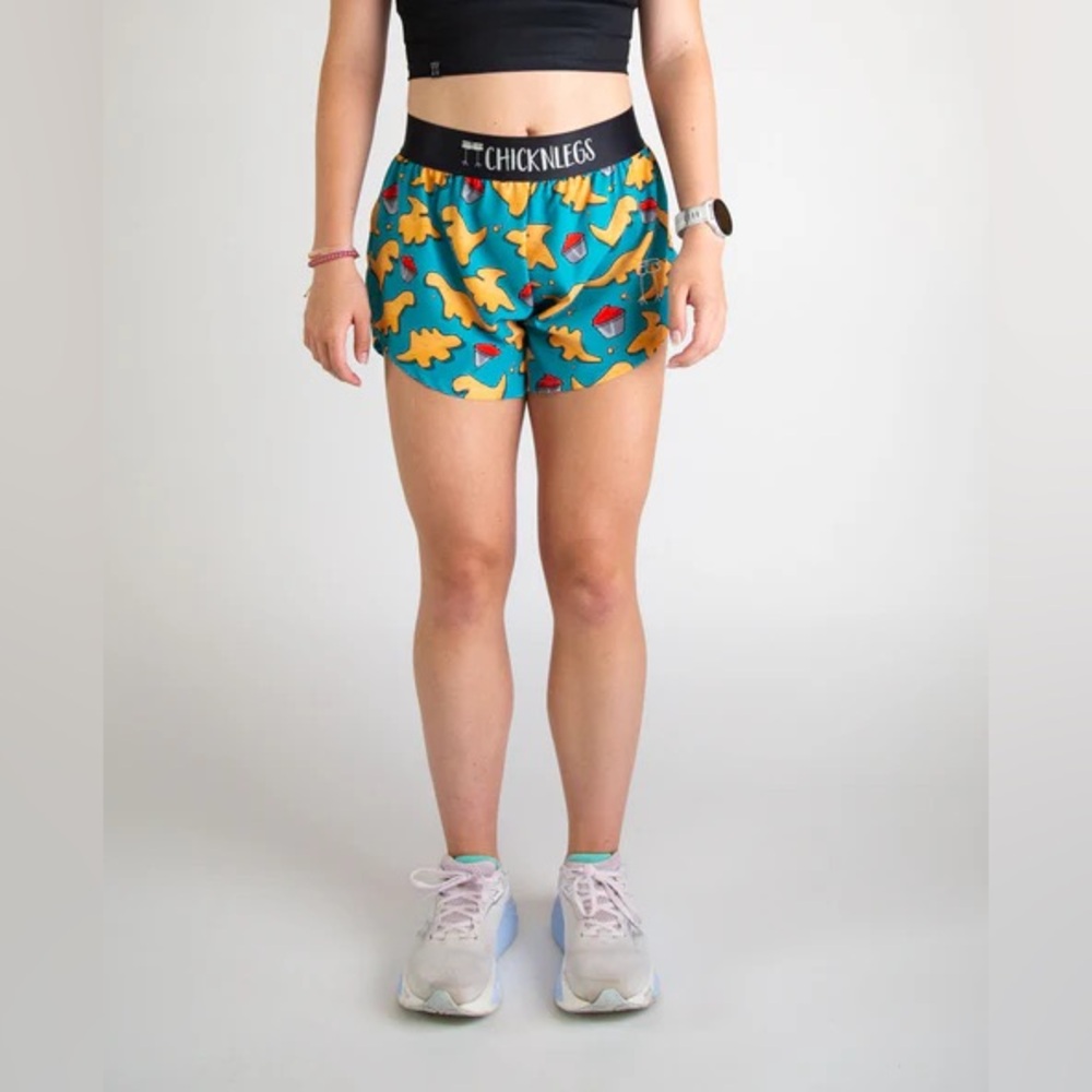 ChicknLegs split leg 4” running shorts with dino nugget pattern